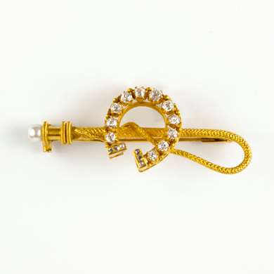 Whip and horseshoe gold and diamond  brooch