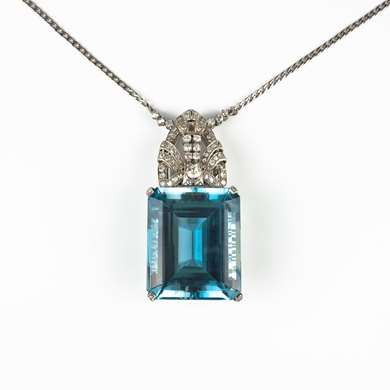 Platinum blue topaz and diamonds pendant