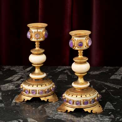 A pair of gilt-bronze and ivory candlesticks 