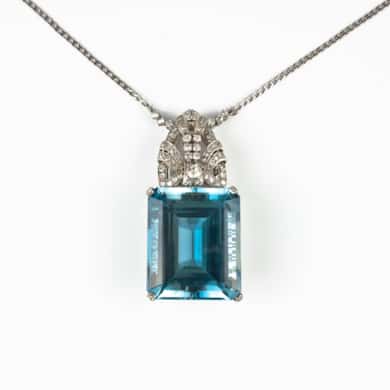 Platinum blue topaz and diamonds pendant